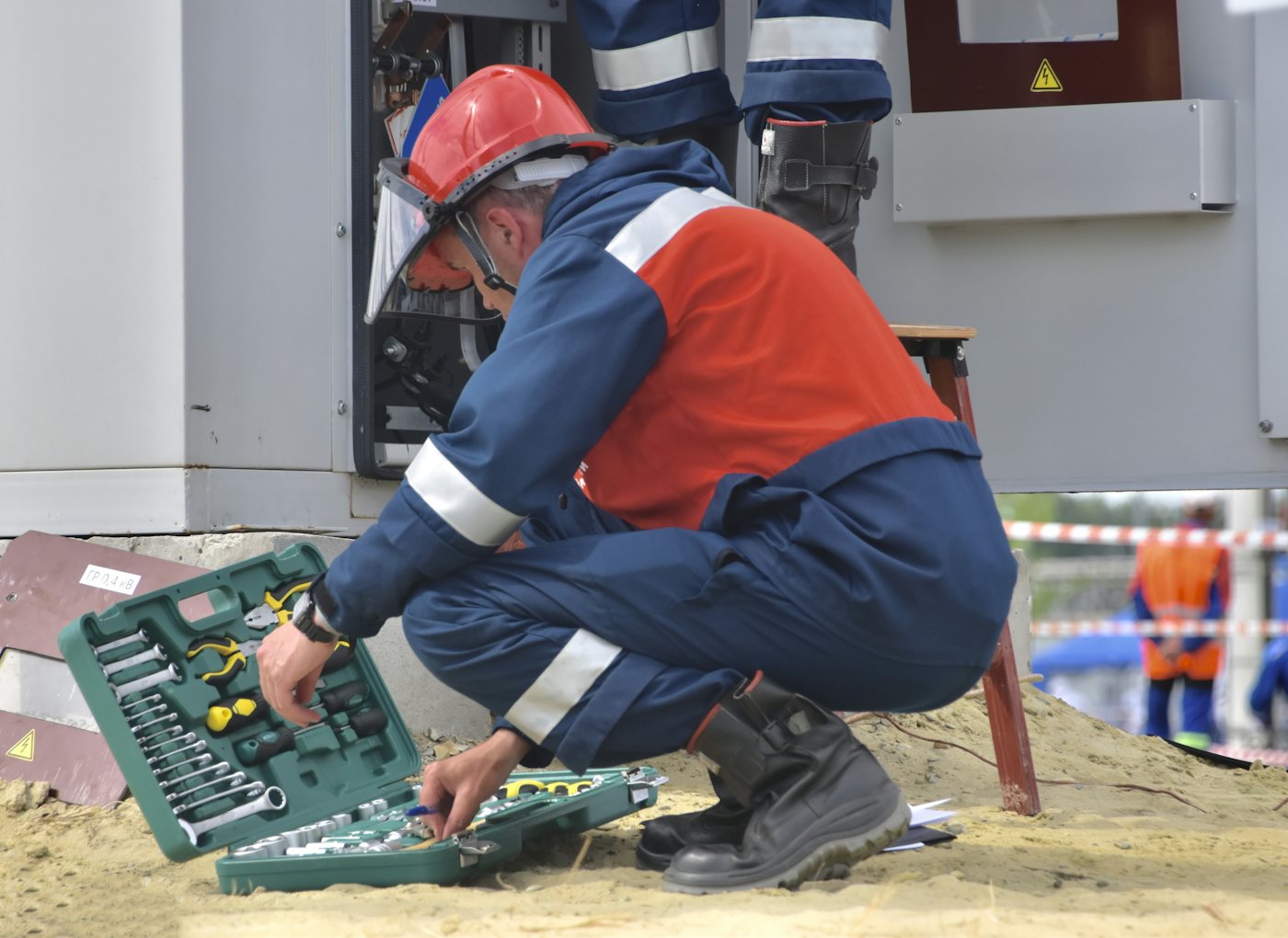 Field technician servicing mechanical equipment on site